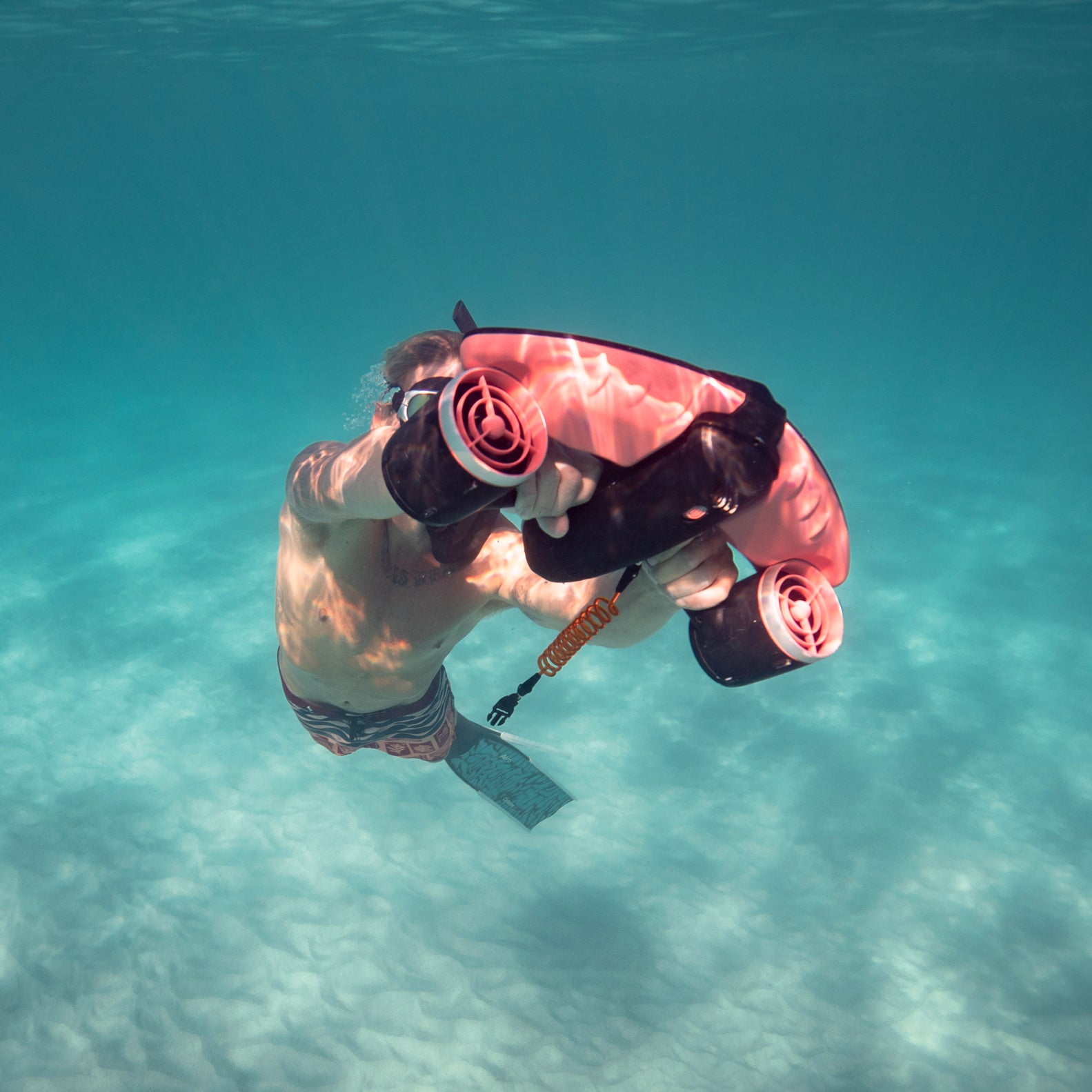 A diver riding the SUBLUE Navbow underwater scooter