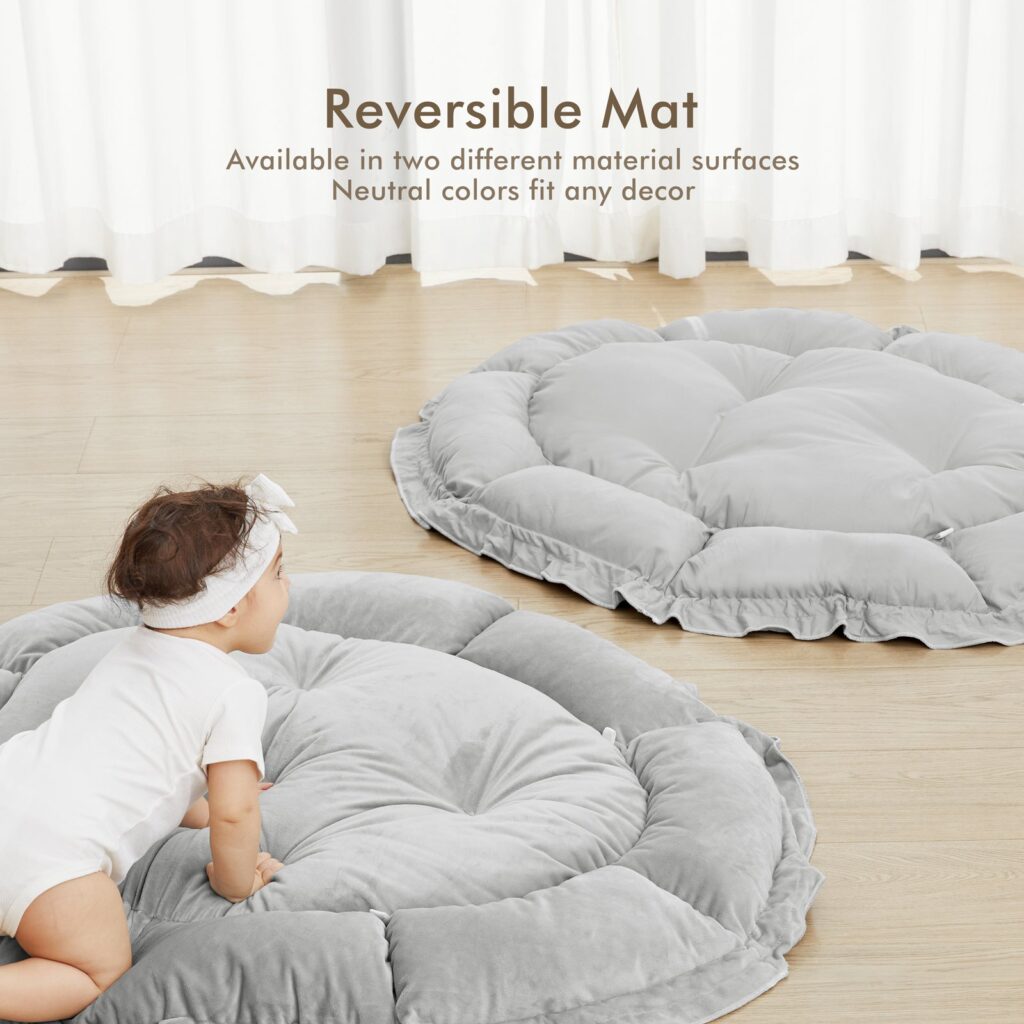 Baby crawling toward the grey Angelbliss play mat, with the mat's reverse side shown beside it