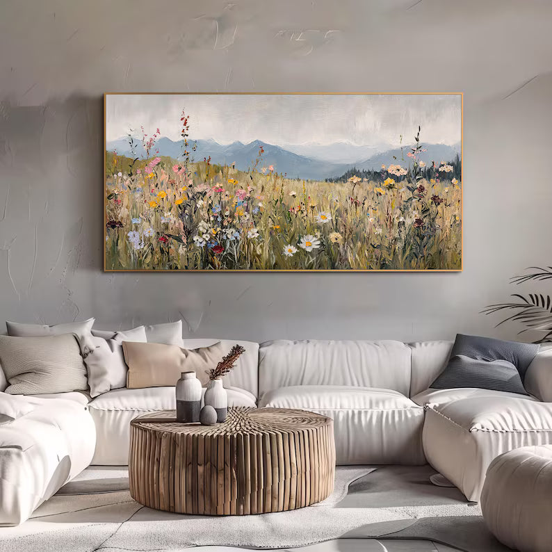 Wildflower Meadow Wall Art in a gold frame above a pale sofa, an example of Artextured's floral and nature styles