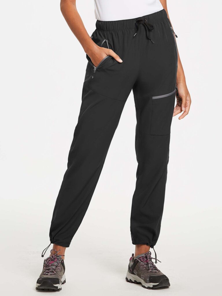Black Baleaf hiking pants with a drawstring waist, zip pockets and toggle cuffs