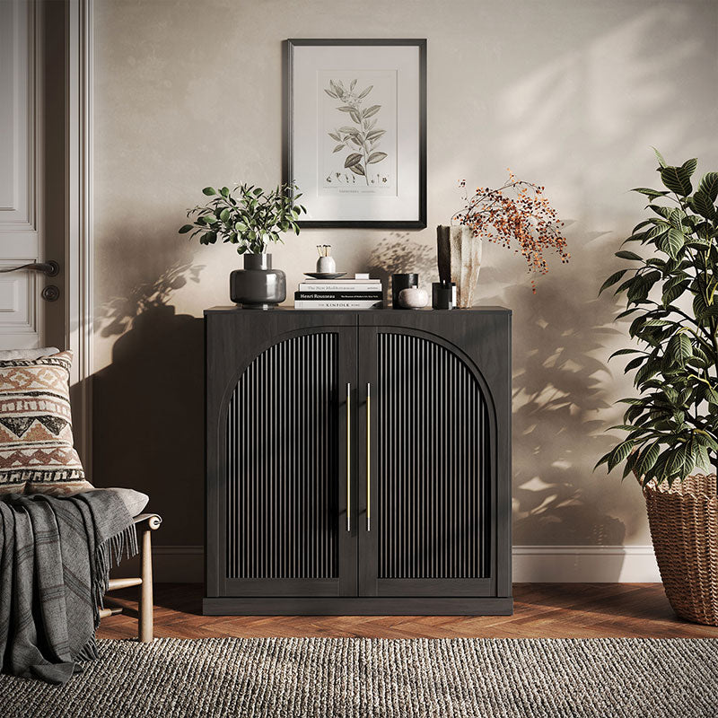 Jagger sideboard in a warm wood finish with fluted arched doors and gold-toned handles in a living room