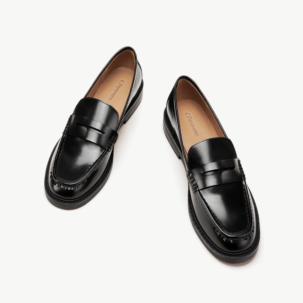 Pair of black Valora penny loafers shown from above