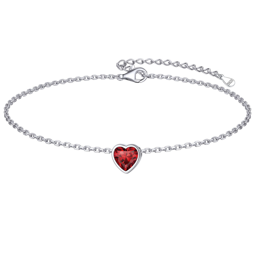 Fine silver chain with a heart-shaped red stone charm, an extender chain and an S925 tag