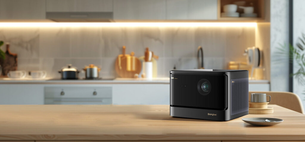 Dangbei DBOX02 4K laser projector sitting on a kitchen counter in a bright home