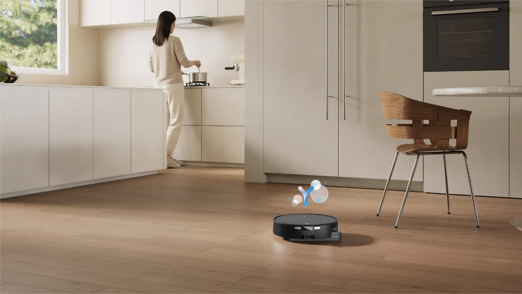 ECOVACS DEEBOT T90 PRO OMNI cleaning a wood kitchen floor with the AGENT YIKO assistant icon above it