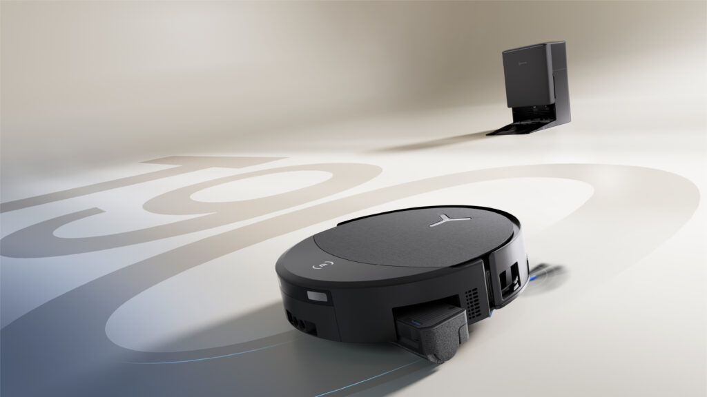 ECOVACS DEEBOT T90 PRO OMNI robot vacuum on a bright floor with its station in the background