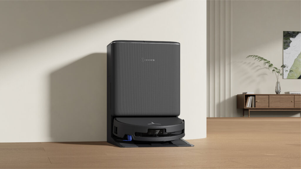 ECOVACS DEEBOT T90 PRO OMNI docked in its OMNI station against a cream wall