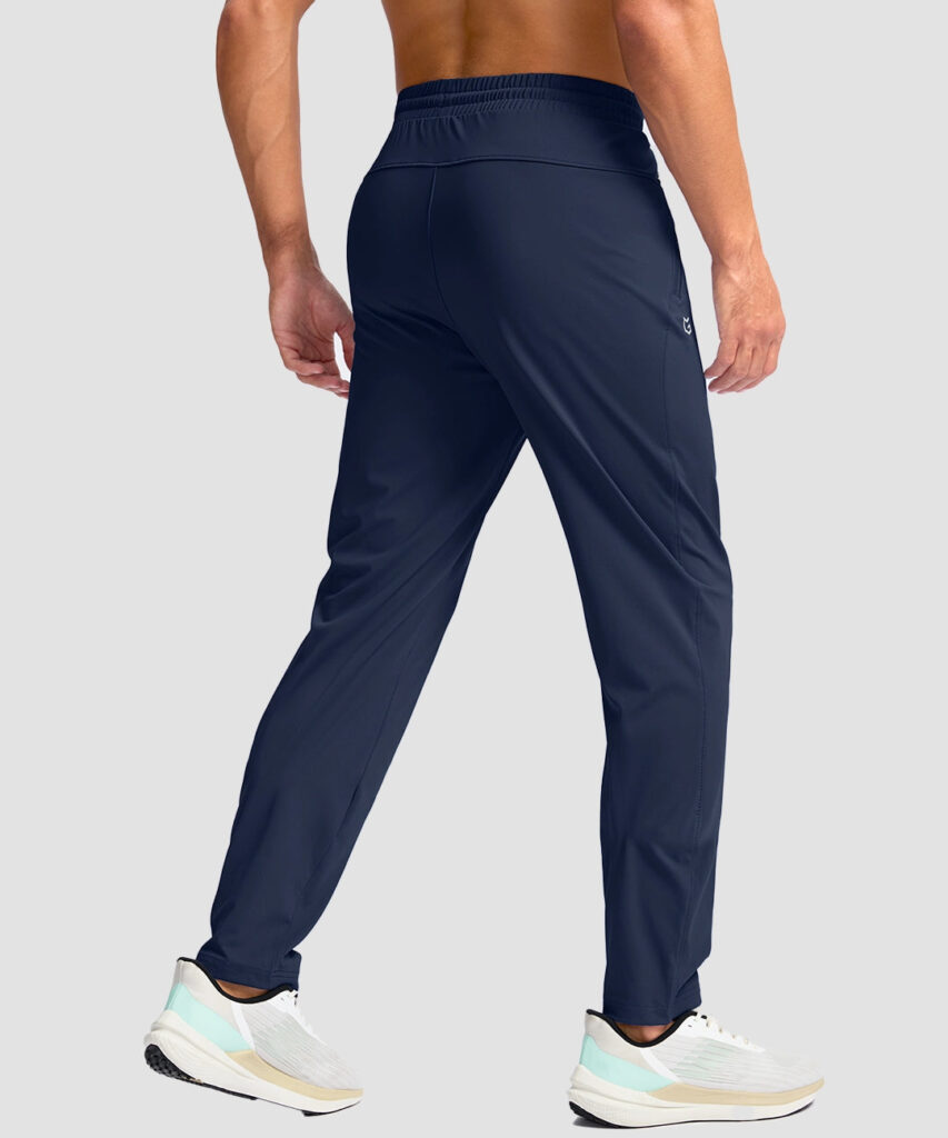 Back view of navy G Gradual Tall Zip Pocketed Tapered Pants showing the tapered leg and waistband