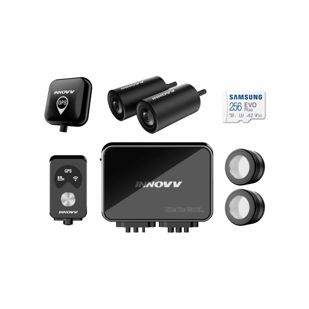 INNOVV K7 kit laid out with a GPS module, two cameras, a control box, a handlebar remote, lens rings and a Samsung microSD card