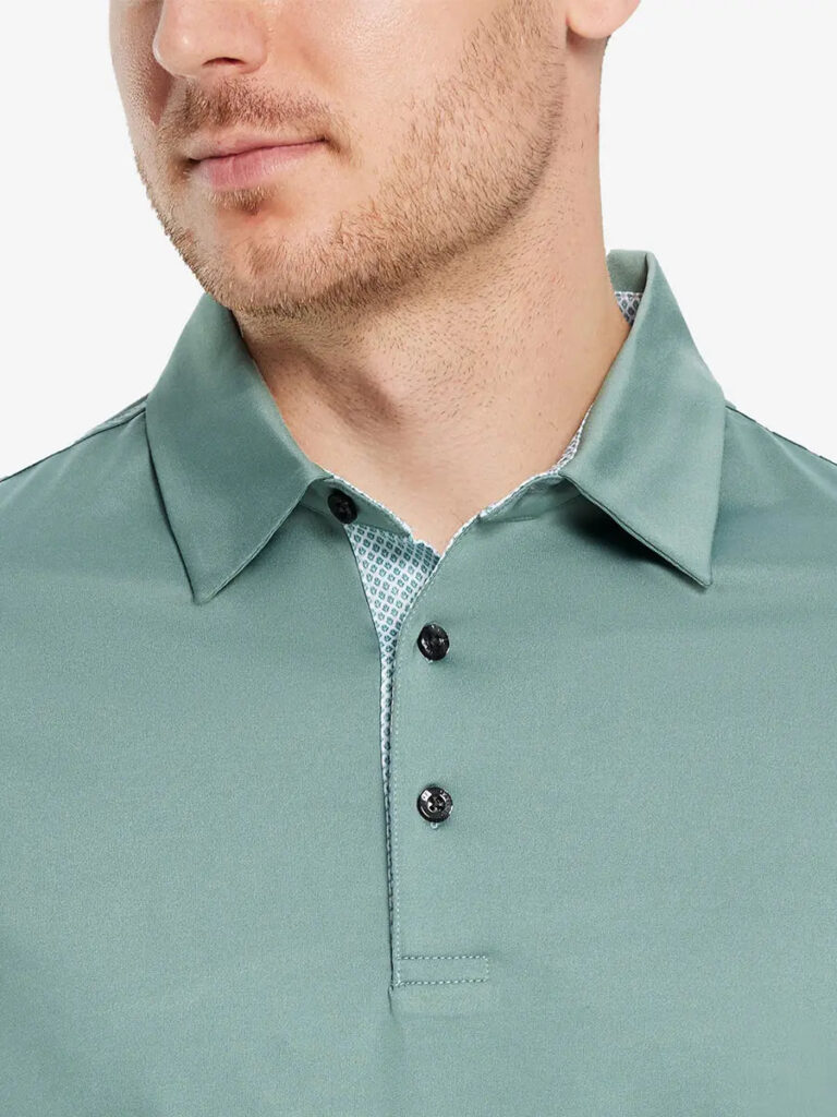 Close-up of the collar and buttons on a sage green Maelreg solid golf polo with a patterned placket