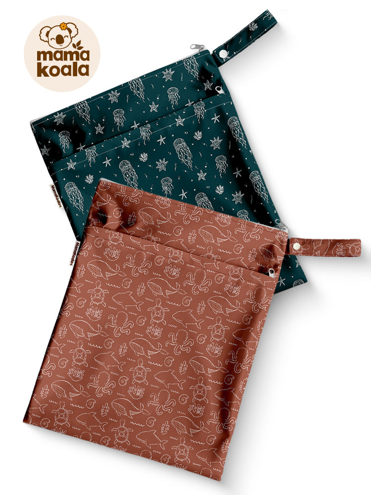Two Mama Koala wet dry bags in printed fabric, one in dark teal and one in rust brown
