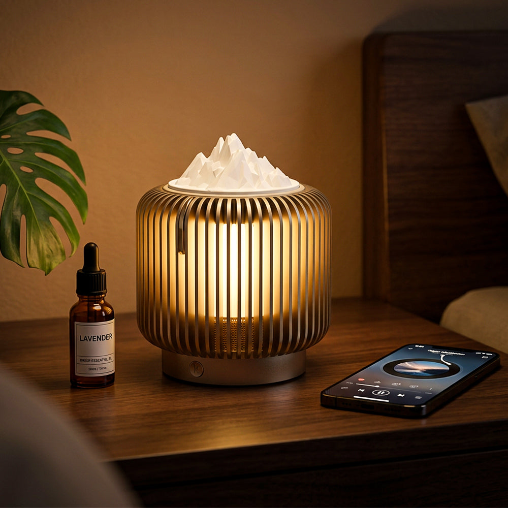 Masdio Flambe Aroma Lamp glowing on a wooden nightstand beside a bottle of essential oil and a phone