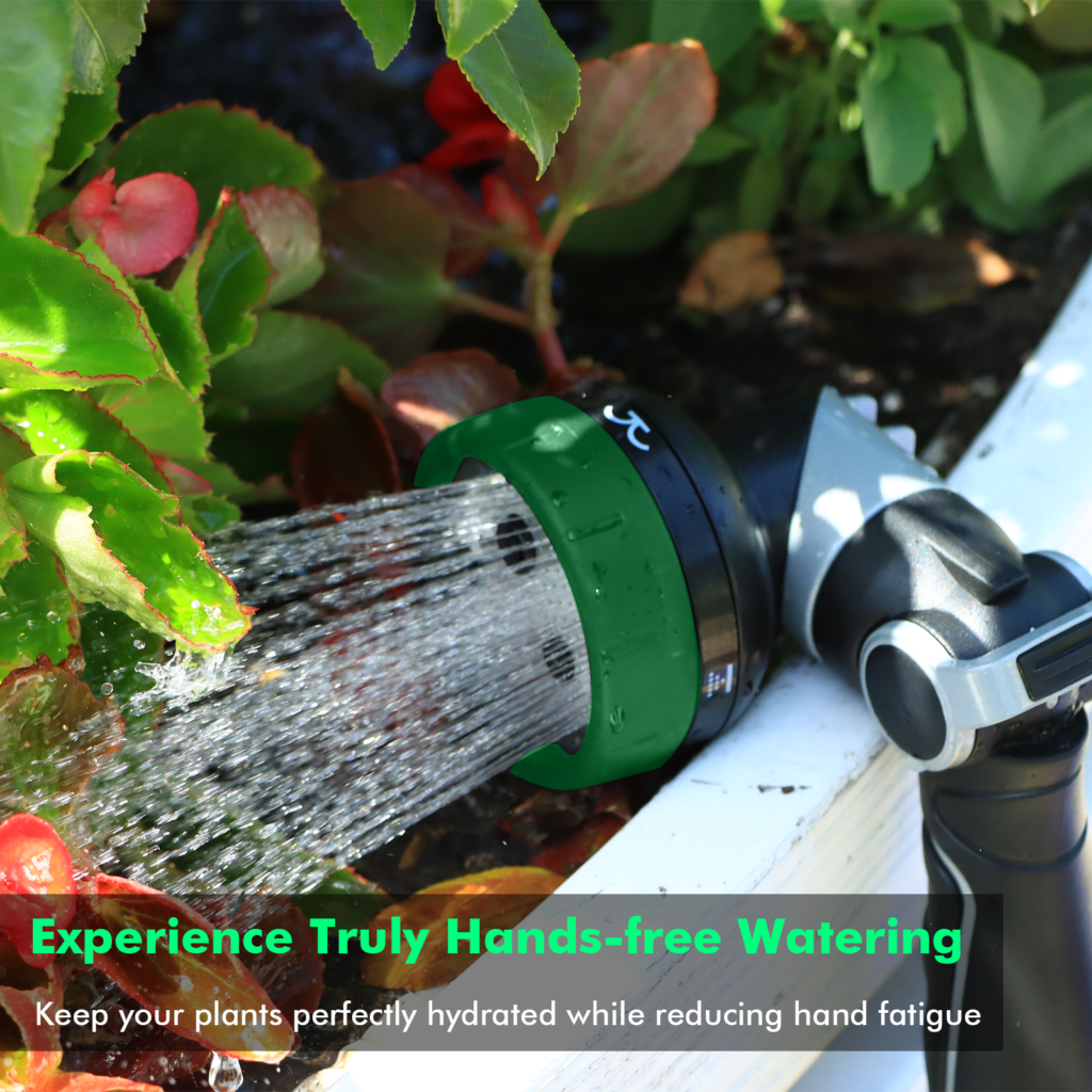 Restmo nozzle with a green dial showering a flower bed in a raised planter