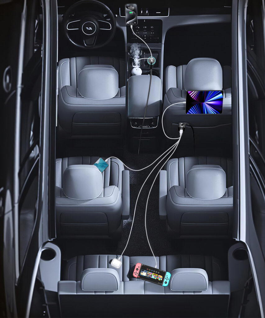 Overhead view of a car interior with charging cables running from the front socket to devices in the rear seats