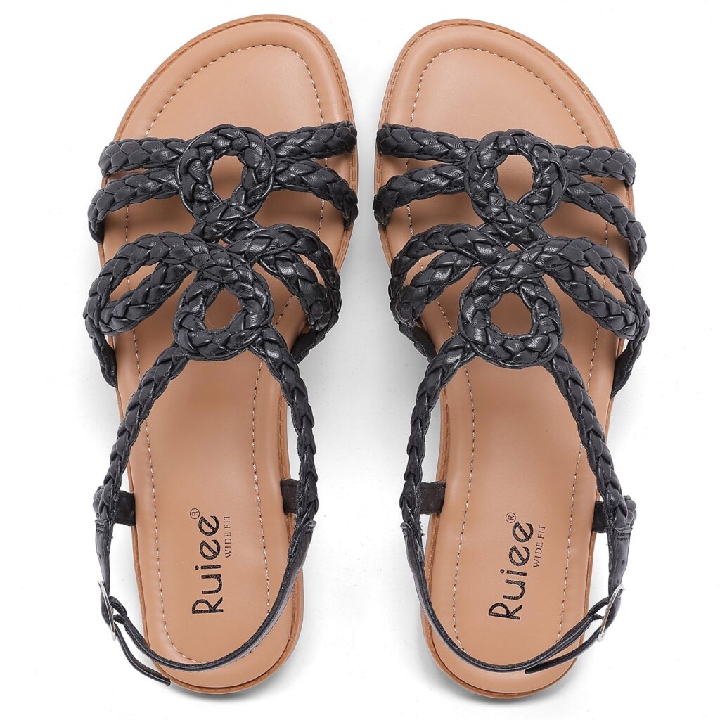 Pair of black braided flat sandals with woven straps and a cushioned footbed, shown from above