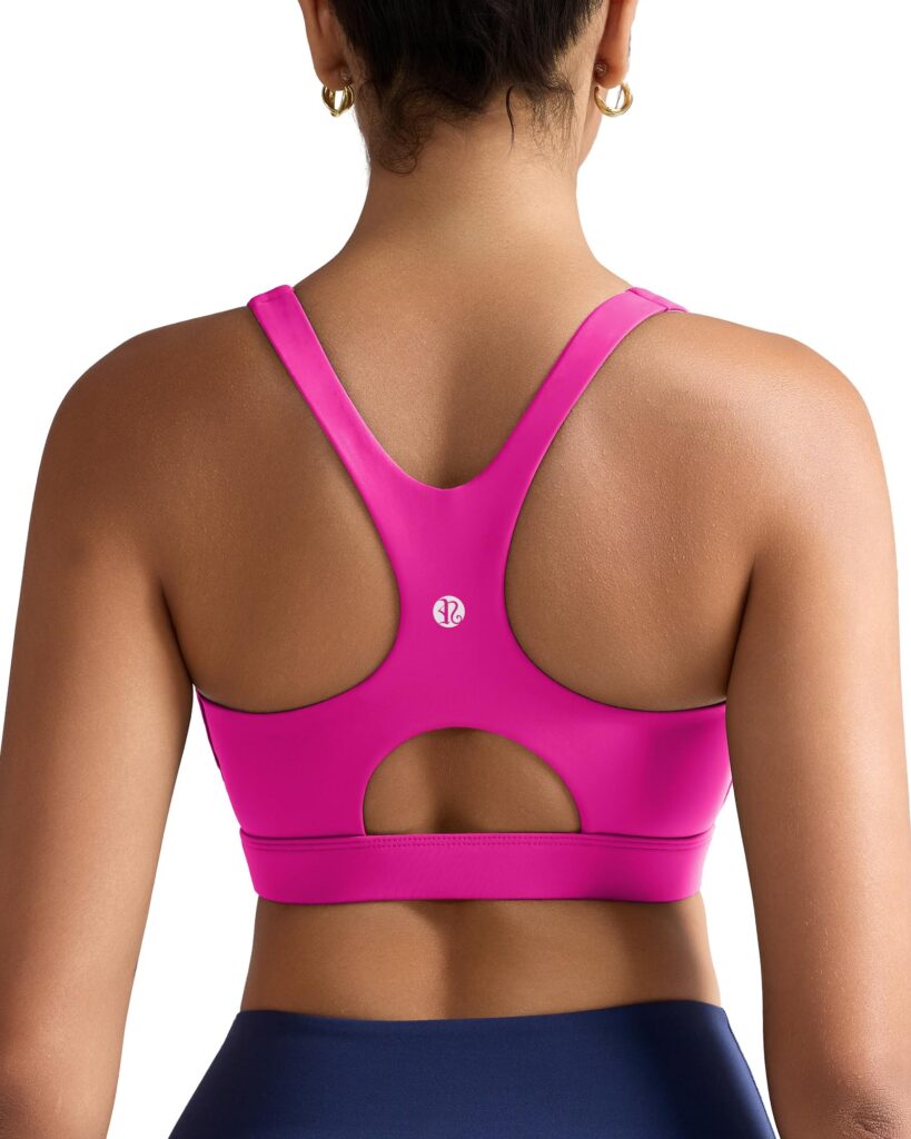 Back view of a hot pink racerback sports bra with wide straps and a keyhole cutout