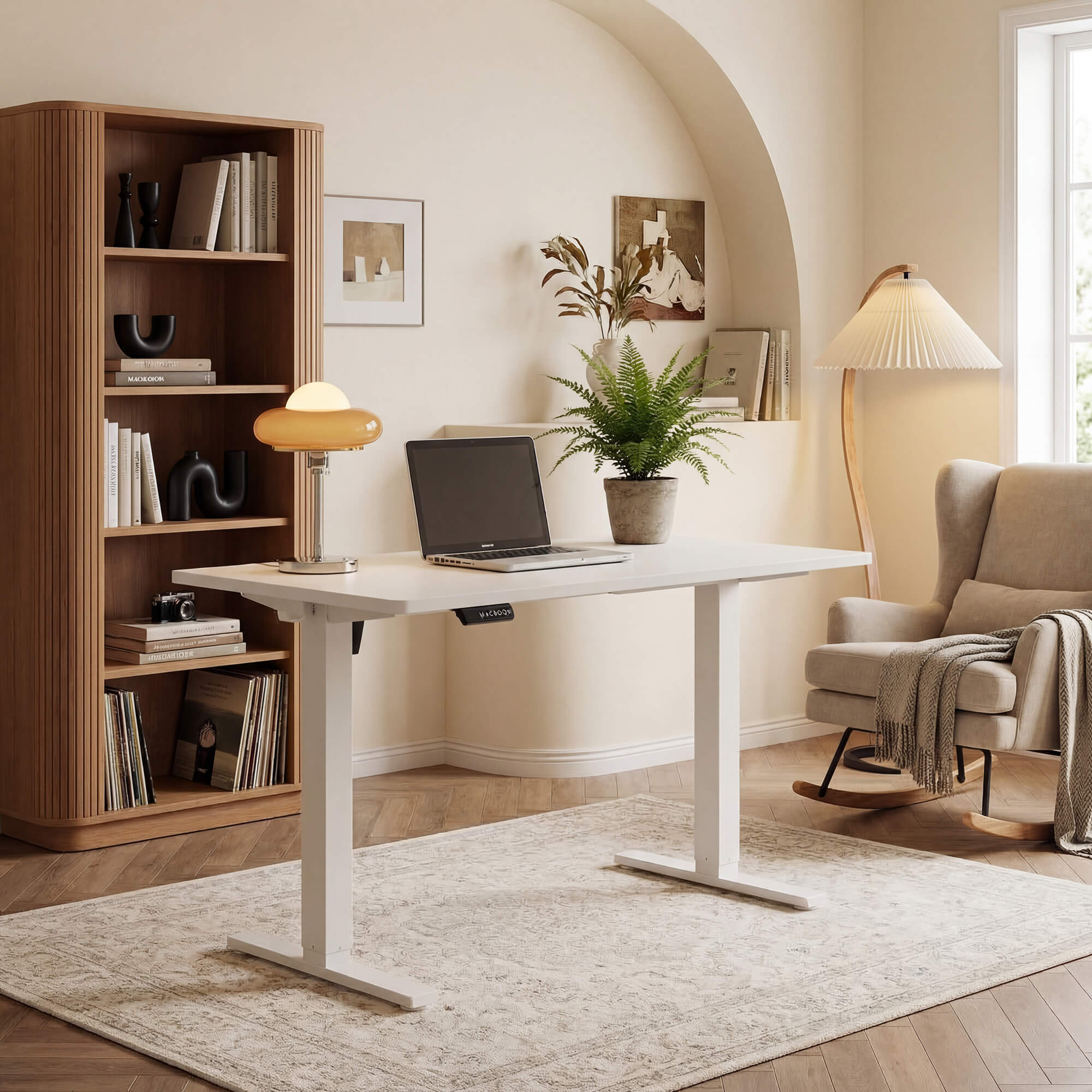 White Sweetcrispy electric standing desk in a home office corner with a bookshelf and an armchair