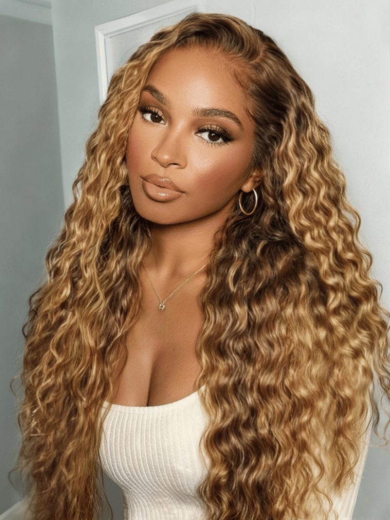 Woman wearing a long water wave wig with caramel-honey highlights, one of UNice's water wave styles