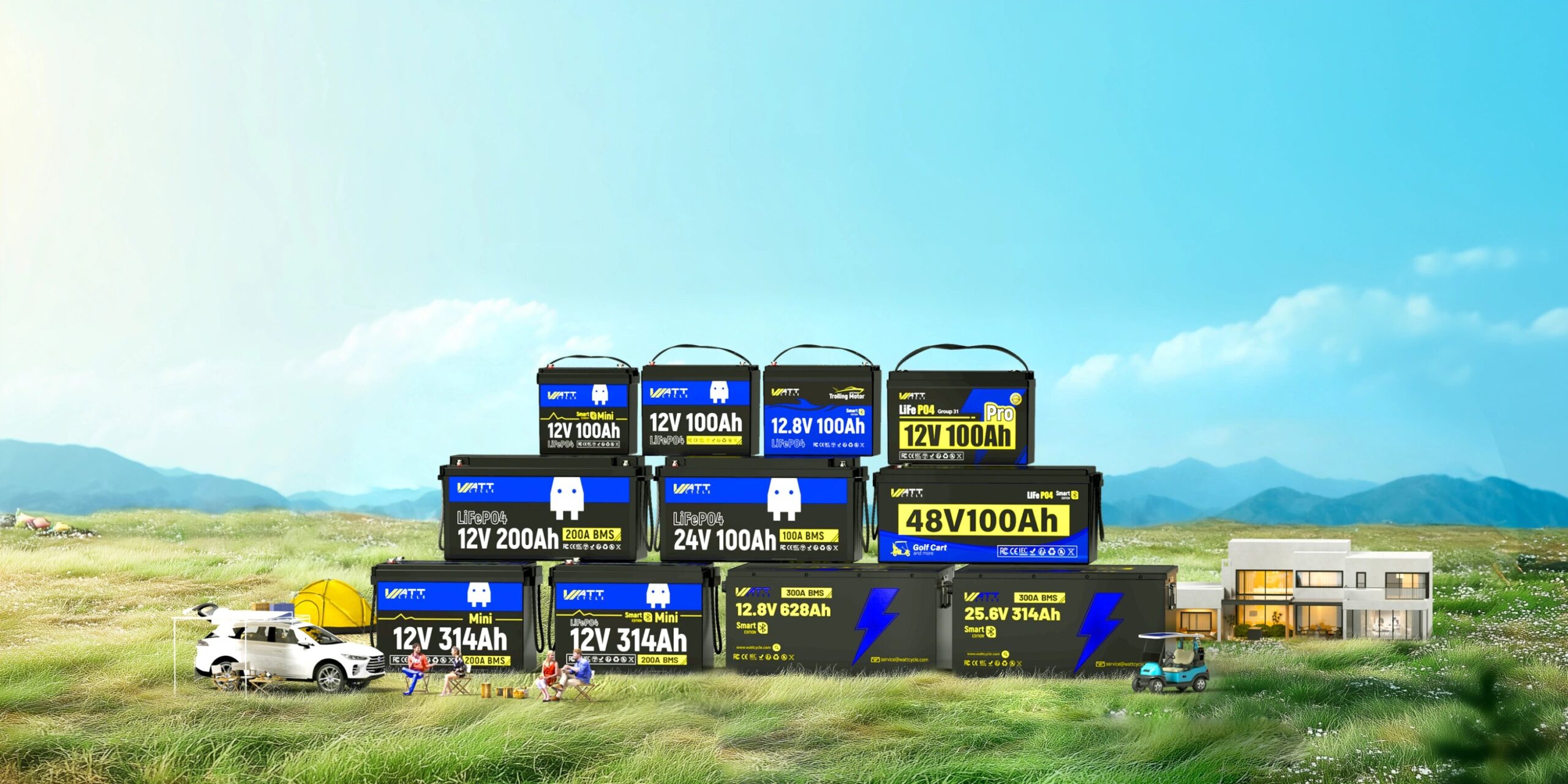 A range of WattCycle LiFePO4 batteries in 12V, 24V and 48V sizes stacked on a grassy field