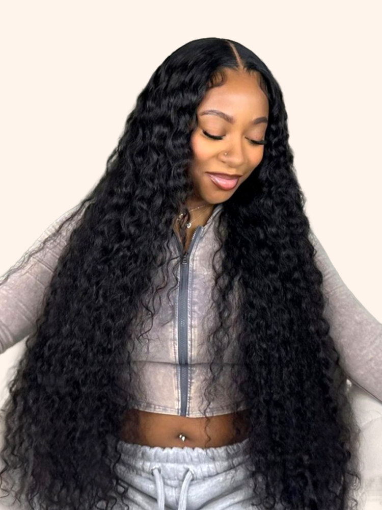 Woman wearing a long deep wave human hair wig from the Wiggins Hair lace frontal range