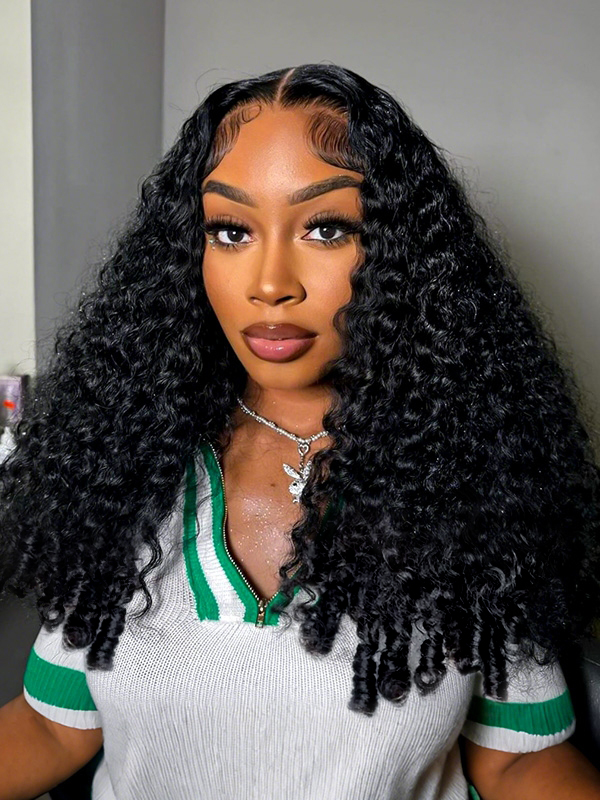 Voluminous curly wig from the Ready And Go glueless line, shown on a model in a green-striped top